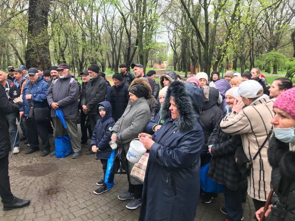 Ukraine outreach families receiving food.