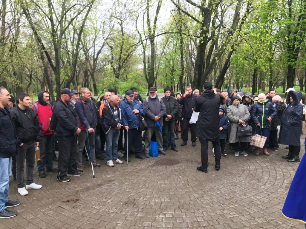 Ukraine outreach-people listening a message.