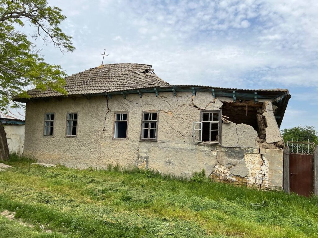 House in Ukraine with hole in the side.