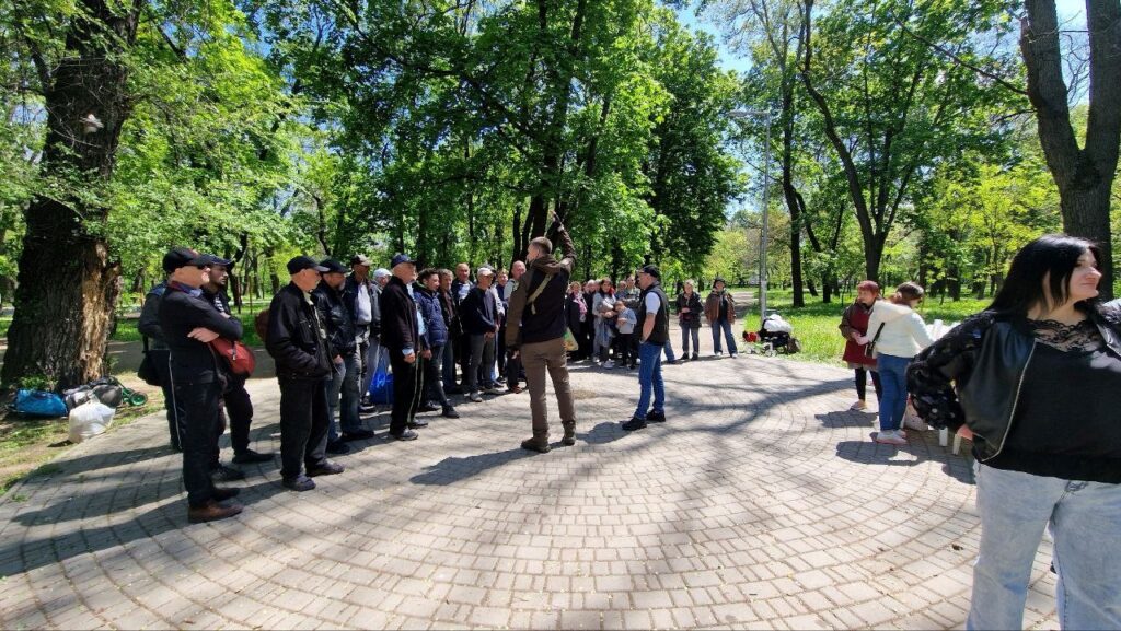 Man speaking to a crowd of Ukrainians.