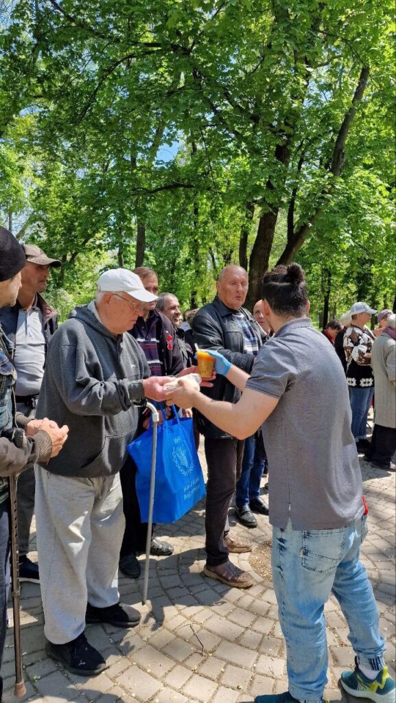 Men receive food.