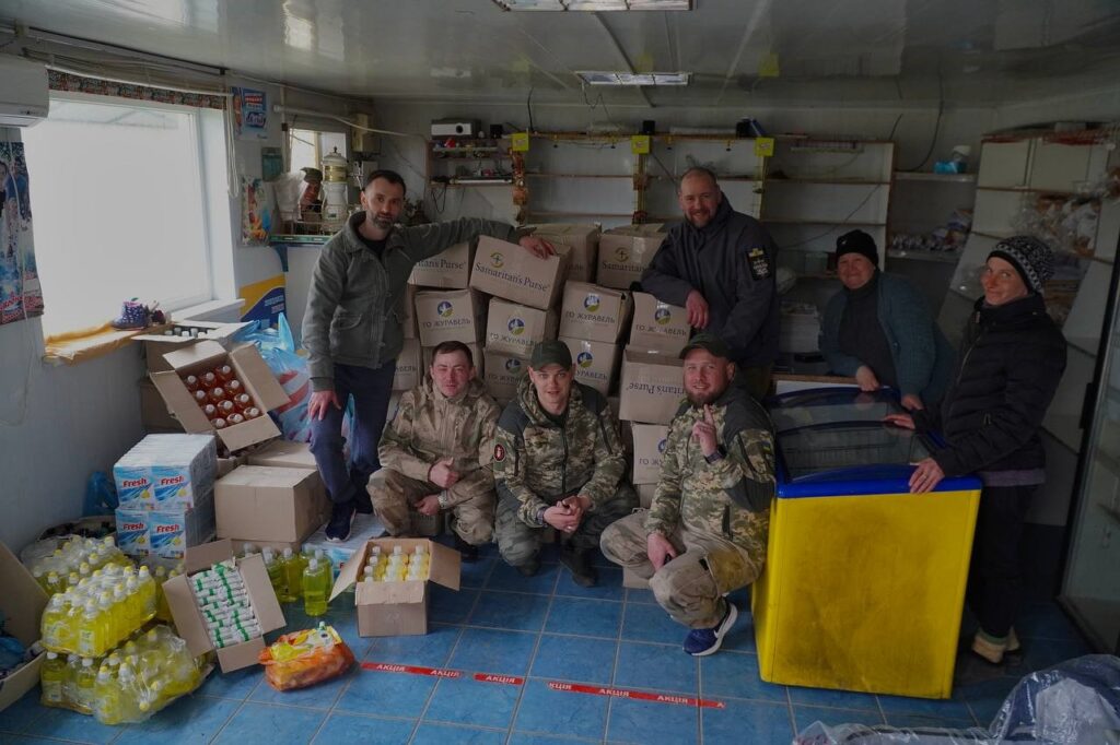 Ukrainians team with supplies.