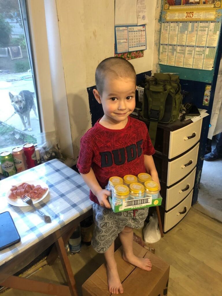 Young boy receives food supplies in Odessa.