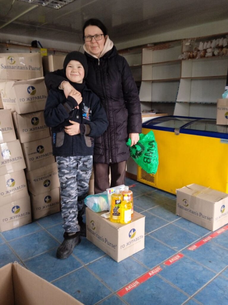 Mother and son receive supplies. 