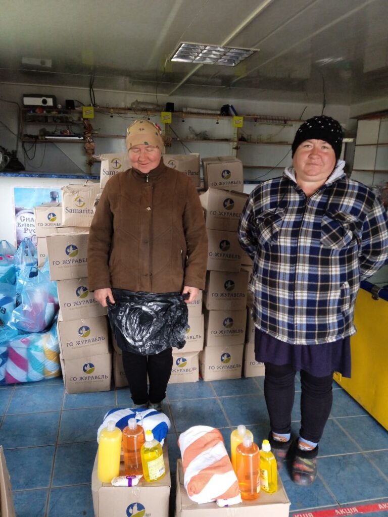 Two women with their new supplies.