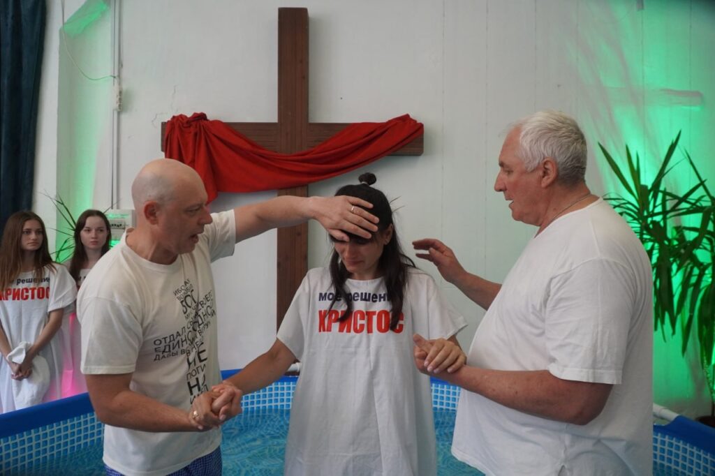 Woman about to be water baptized.