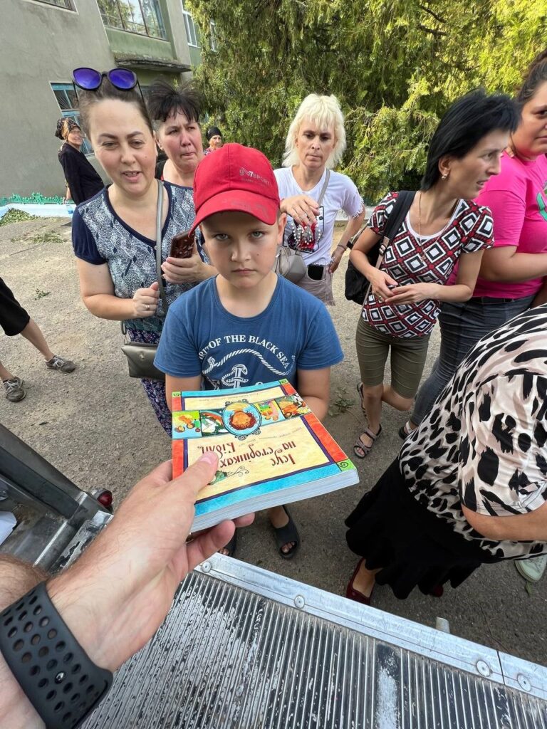 Boy in Ukraine receives children's Bible.