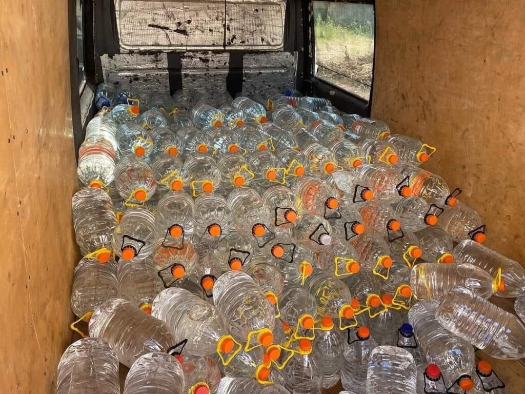 Gallons of water loaded in a truck.