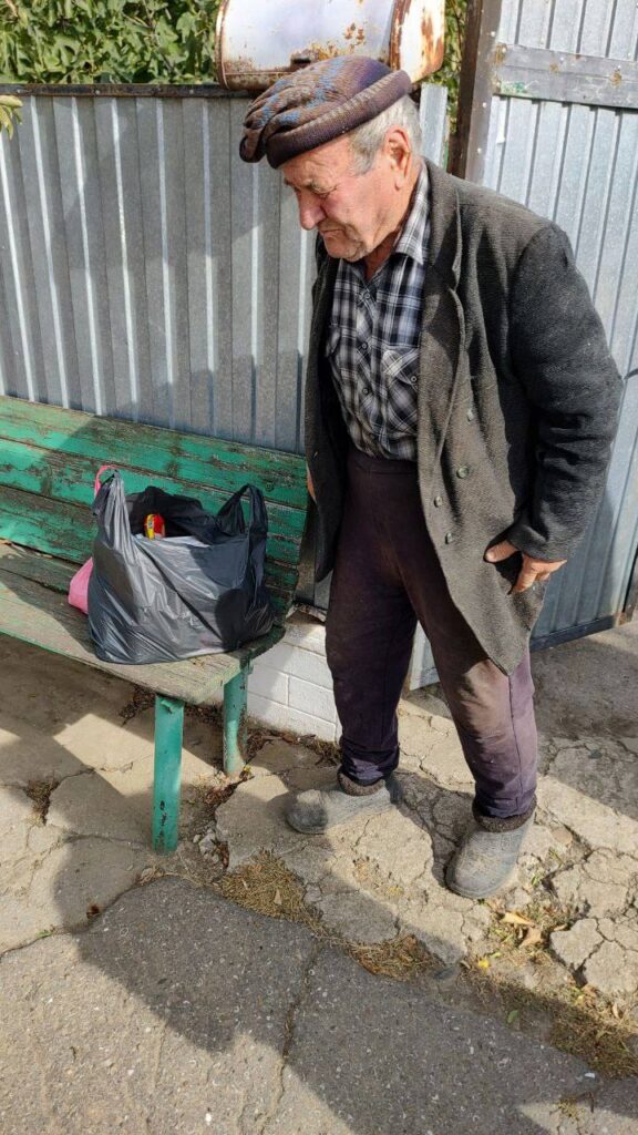 Older gentleman with bag of items
