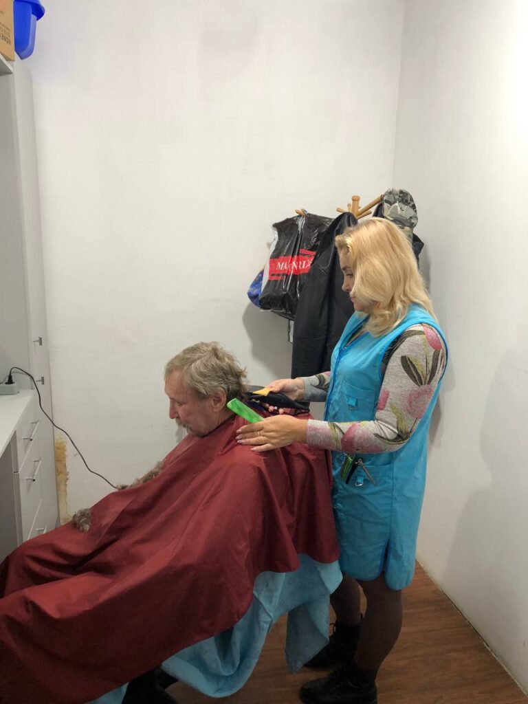 Woman giving haircut