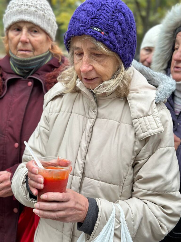 Close-up of one woman holding free soup
