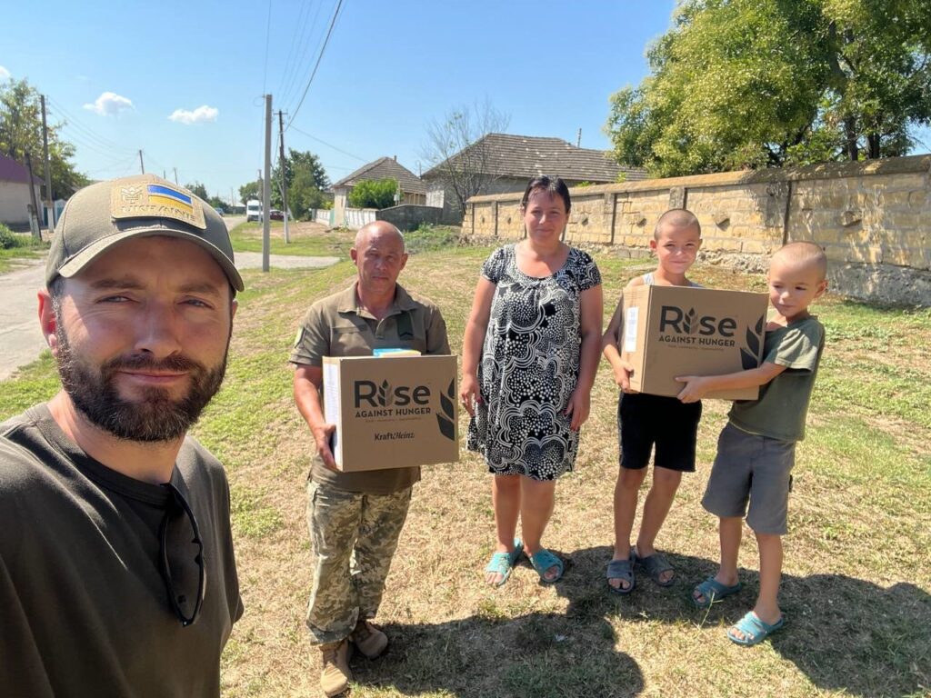 Group of people with box of food