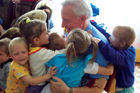 Sid with children at orphanage